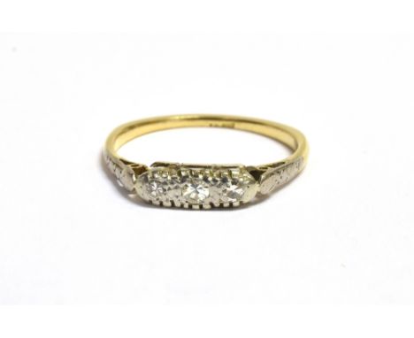 RETRO DIAMOND DRESS RING in narrow boat setting in white metal with three tiny diamonds on a yellow metal band with indistinc