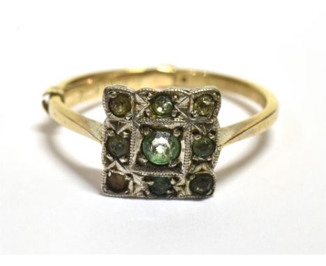 A MARKED 9CT SILVER&nbsp; VINTAGE PLAQUE RING The ring set with a square white metal plaque with 9 green paste stones, plaque