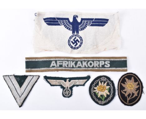 Selection of Mixed Third Reich Cloth Insignia, consisting of Waffen-SS pattern mountain troops edelweiss sleeve insignia, Afr