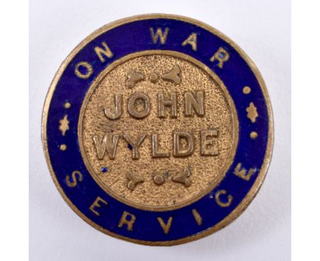 WW1 On War Service John Wylde Lapel Badge, gilt brass circular badge with blue enamel border. Un-marked reverse. Generally go