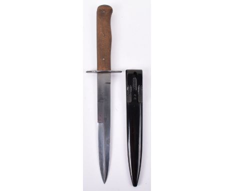 WW2 German Combat Boot Knife, two piece wood slab grips with three securing pin fittings. Plain cross guard. Housed in its or