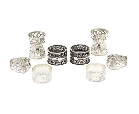 THREE PAIRS OF VICTORIAN SILVER NAPKIN RINGS one pair with twin filigree and bead borders, each with an applied vacant oval, 