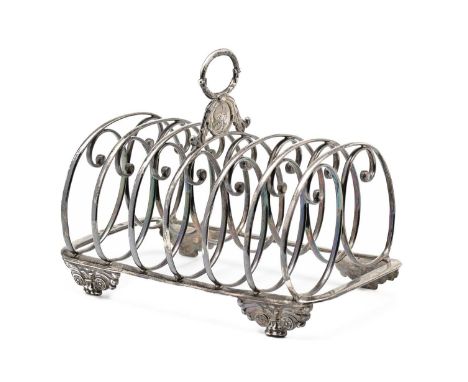 A GEORGE IV SILVER TOAST RACK, JOHN & THOMAS SETTLE, GUNN & CO., SHEFFIELD, 1827 the oblong base with seven scrolled bars cen