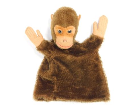 A 20thC textured monkey glove puppet.