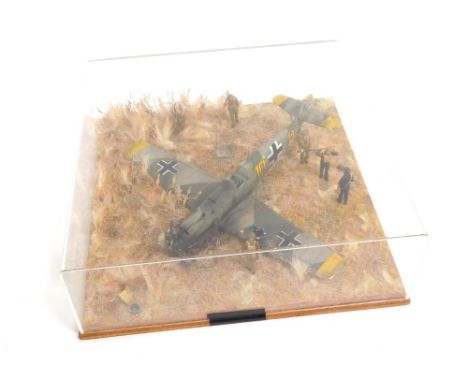 A cased diorama model of a crashed ME109E, in Battle of Britain 1940, 1:32 scale. 