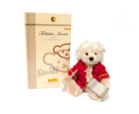 A Steiff Mozart teddy bear, ivory, 28cm high, limited edition, boxed. 