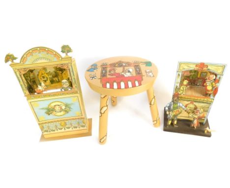 A Punch &amp; Judy decorative stool and a cardboard Clarke Strand, Reproduction Punch &amp; Judy puppet set, in made conditio