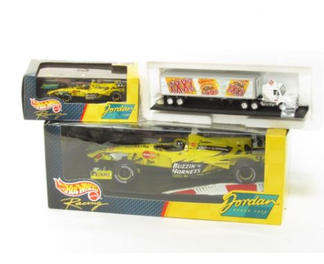 A Hot Wheels  Damon Hill's Jordan Mugan Honda 199 launch version , 1:18 scale, a Hot Wheels Damon Hill Jordan 119 , 1:43 scal