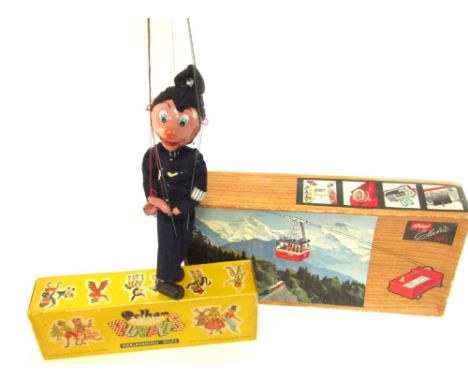 A mid 20thC Pelham Puppet policeman, and a Riga electric 900E cable car, boxed.  (2)