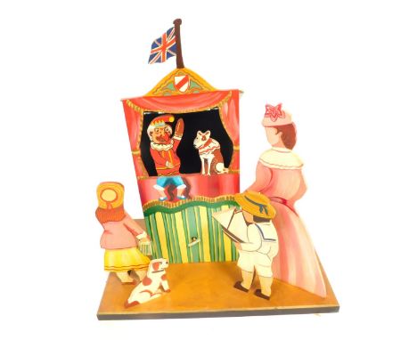 A modern Punch &amp; Judy wooden clockwork musical automaton, decorated in colours, 43cm high.