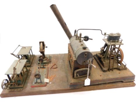 A Doll Toy Company Live Steam engine, model 360/4, with Mamod grinding wheel, Mamod band saws, and Mamod lathe.