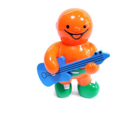 A 20thC plastic Jelly Baby money box, the figure playing guitar, in blue orange and green, 28cm high, and a group of Teddy Be