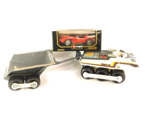 A Burago 1:18 scale die cast Ferrari 250 Testa Rossa 1957, boxed, and a Big Track MB Electrics truck with transporter.  (3)