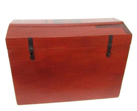 A domed top pine child's trunk, with metal side carrying handles, painted red, 59cm H, 90cm W, 49cm D. 