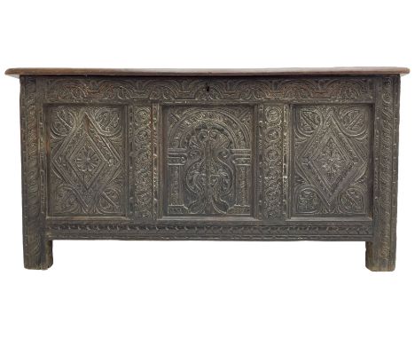 18th century oak coffer, the triple panelled hinged lid with moulded frame over triple panelled front, foliate arcade carved 