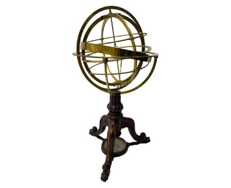 19th century brass terrestrial armillary sphere on rosewood base, lobe carved column on three splayed supports with scrolled 