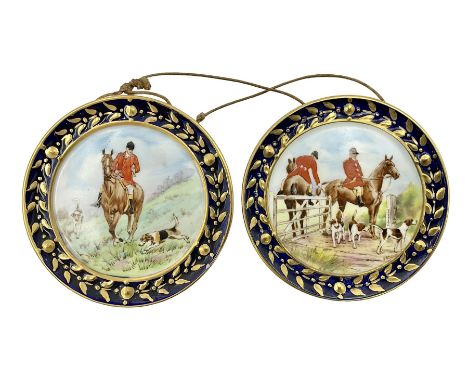 Pair of Royal Crown Derby miniature plaques, circa 1954-1955, of circular form, centrally painted with fox hunting scenes, wi