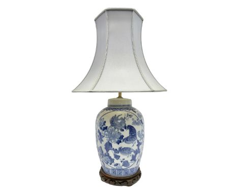 Chinese blue and white table lamp of baluster form, decorated with birds and floral displays, on hardwood base with shade, H7