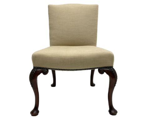 Early 20th century Chippendale design mahogany chair, shaped cresting rail upholstered in pale fabric with a studded bands, o