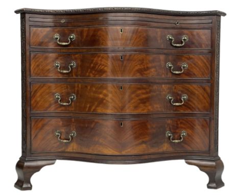 Chippendale design serpentine chest, shaped moulded top carved with repeating flower head motifs, fitted with brushing slide 
