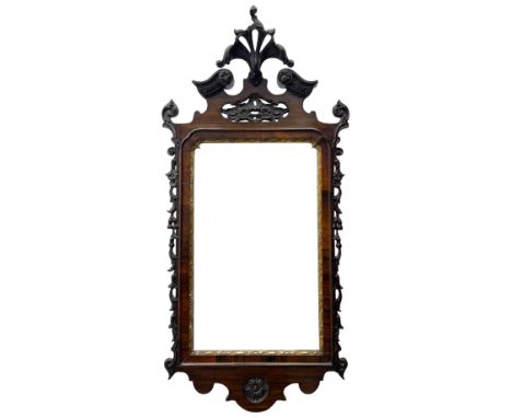 19th century Chippendale design wall mirror, the pierced cresting finial carved with extending foliate decoration, flanked by