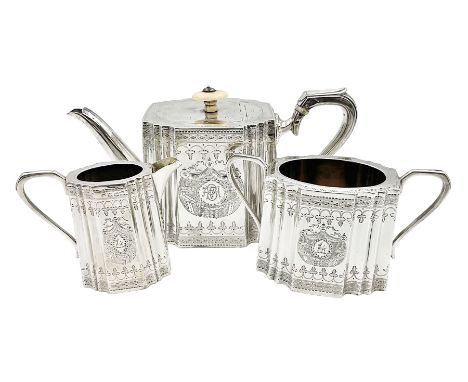 Victorian three-piece silver tea service, comprising teapot, twin handled open sucrier and milk jug, of oval form with shaped