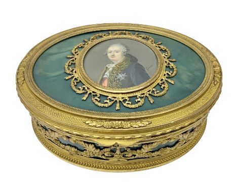 Continental box of oval form, gilt mounted with scroll and foliate garland decoration, the hinged cover inset with a circular