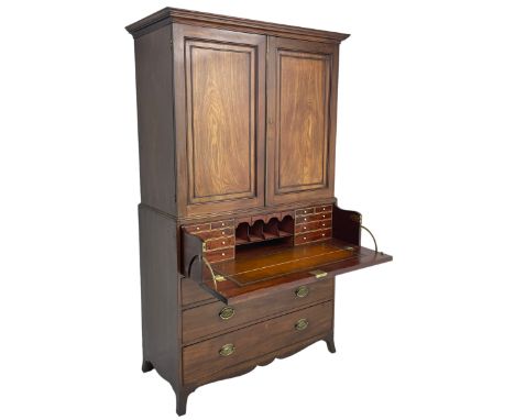 George III mahogany secretaire press, the projecting cornice over two panelled doors with reeded brass door slip enclosing tw