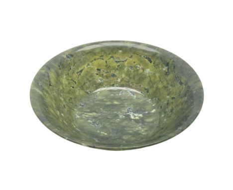 Chinese carved spinach jade bowl, with deep rounded sides rising to a flaring rim from a short circular foot, D21cm