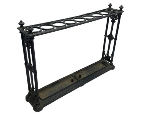 Coalbrookdale design - late 19th century black finish cast iron stick stand, the rectangular top set with one row of nine cir