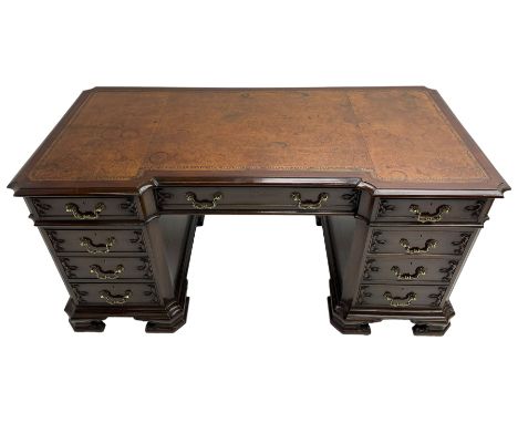 Chippendale design mahogany reverse break-front twin pedestal desk, moulded top with tooled inset leather, fitted with nine c