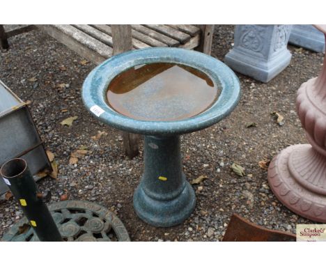 A ceramic bird bath