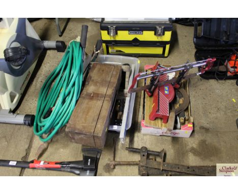 A quantity of garden hose, garden shears, workshop tools, mitre saw etc.