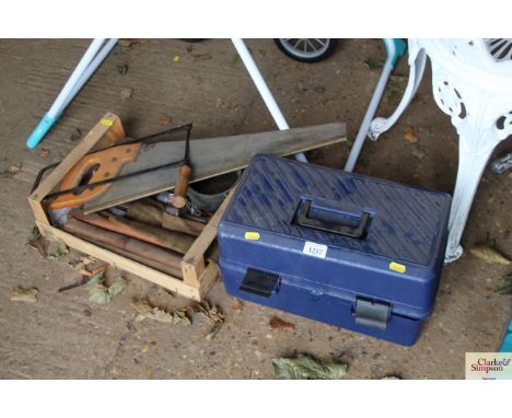A plastic toolbox; and a wooden tray of various hand tools