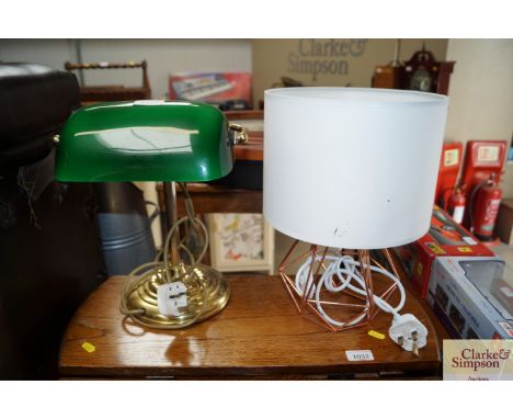 A desk lamp with green glass shade and a modern table lamp