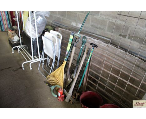 A roll of weed control to measure 14m x 1m (as new); and a variety of long handled garden tools; and a Yankee 5 tonne bottle 