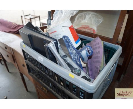 A box of various decorators tools and accessories