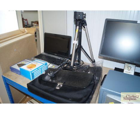 A Velvon camera tripod together with a briefcase
