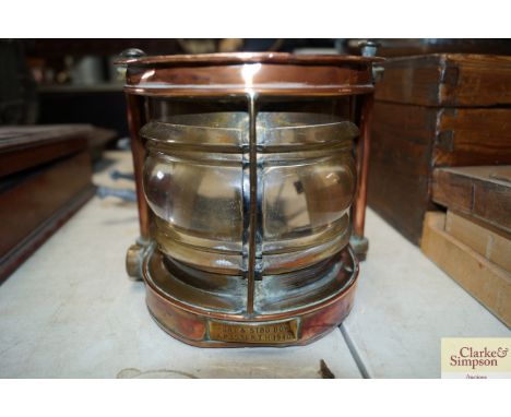 A brass and copper port and starboard lamp