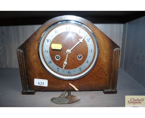 An oak two hole mantel clock