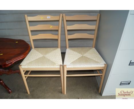 Two string seated and ladder back chairs