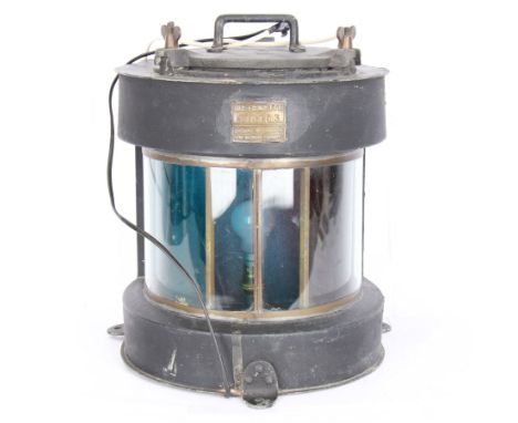 Meteorite ship's lamp converted to electricity, painted in black matte finish, with applied brass plaque inscribed 'Trawler' 