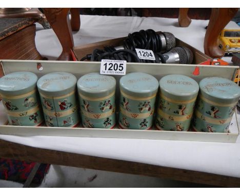 A retro tin spice tins in shelf bracket 