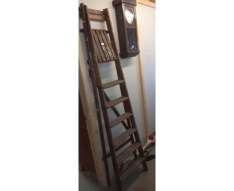 A tall wooden step ladder