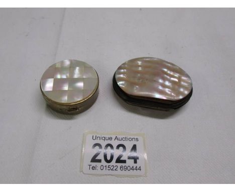 A miniature purse with mother of pearl and a mother of pearl pill box. 