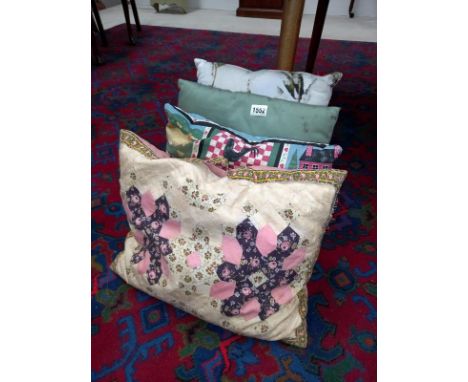 4 cushions, 1 being quilt patch work 
