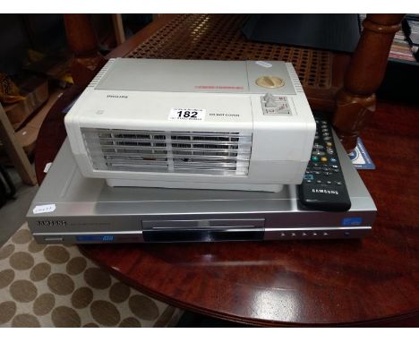 A Samsung DVD player (with remote) and a Philips fan heater (DVD model DVD-E732)