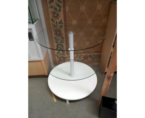 A circular display table, 2 glass shelves and wood base shelf ( 73cm diameter x 82cm tall)