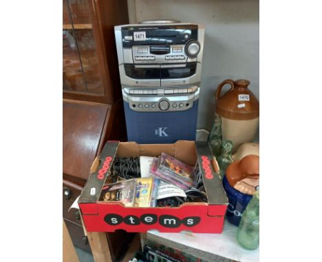 A compact disc karaoke system with 2 microphones, instructions, wires &amp; some karaoke CD's (system model No: EK-475CD+G) C