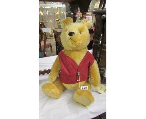 A Steiff limited edition Winnie the Pooh bear.